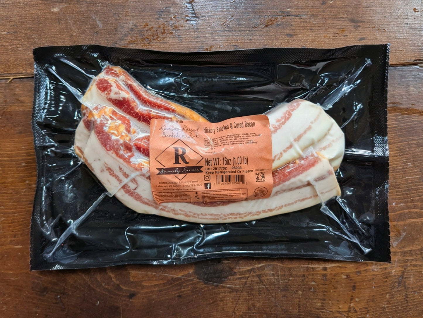 Packaged bacon with a label on a wooden surface