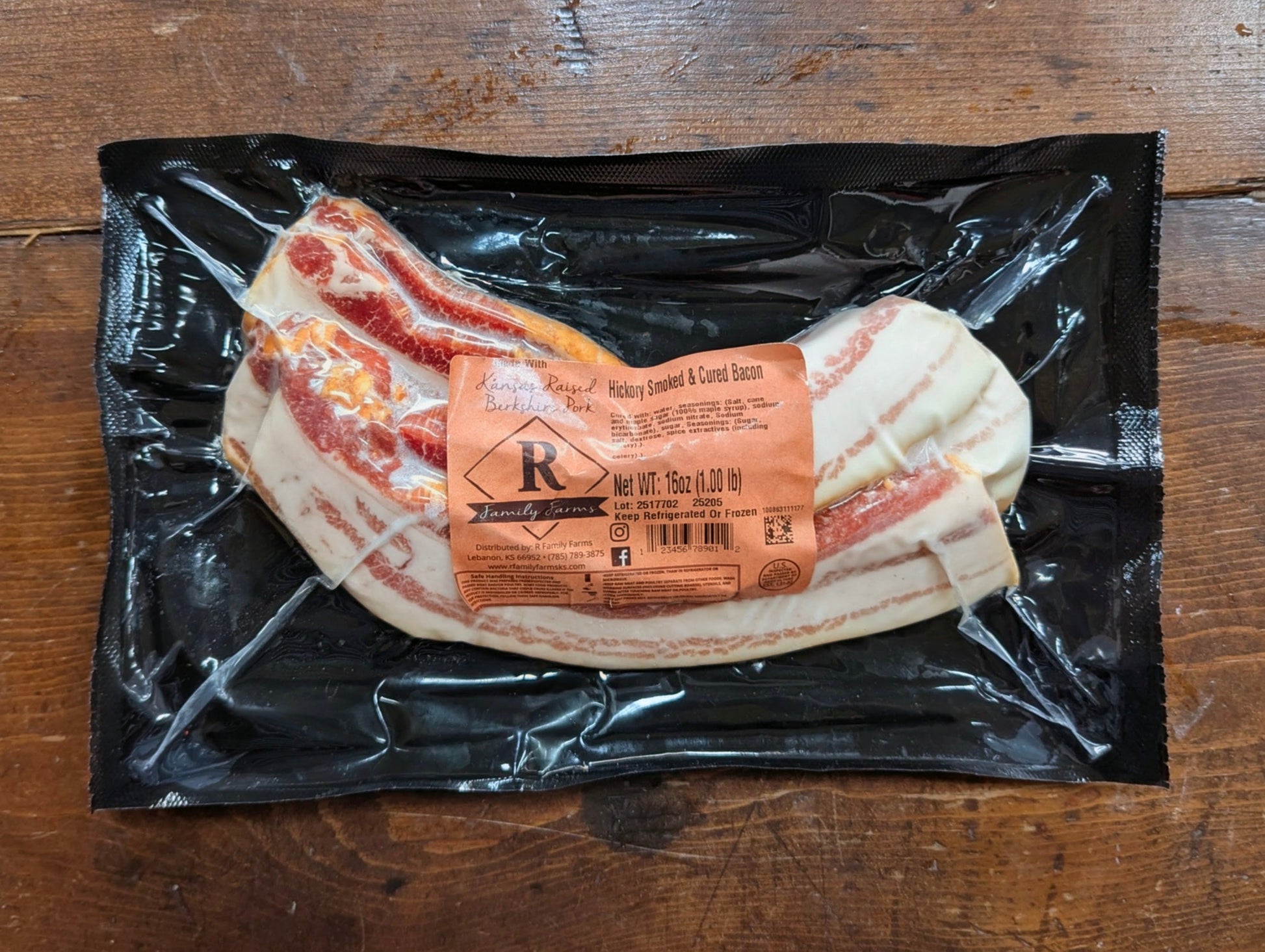Packaged bacon with a label on a wooden surface